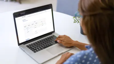 Woman sitting in front of the laptop