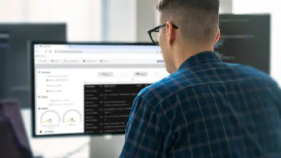 Man looks at a dashboard on the PC screen