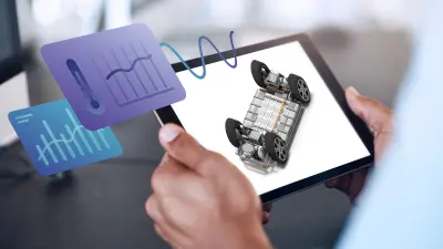 Tablet displaying an electric vehicle drivetrain model with overlaid temperature and performance data graphics.