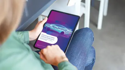 Woman looking at tablet with white paper title page